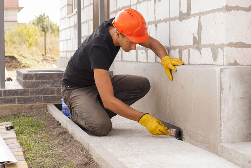 man leveling the wall