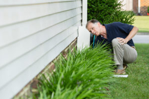 man in the garden checking the leakage 